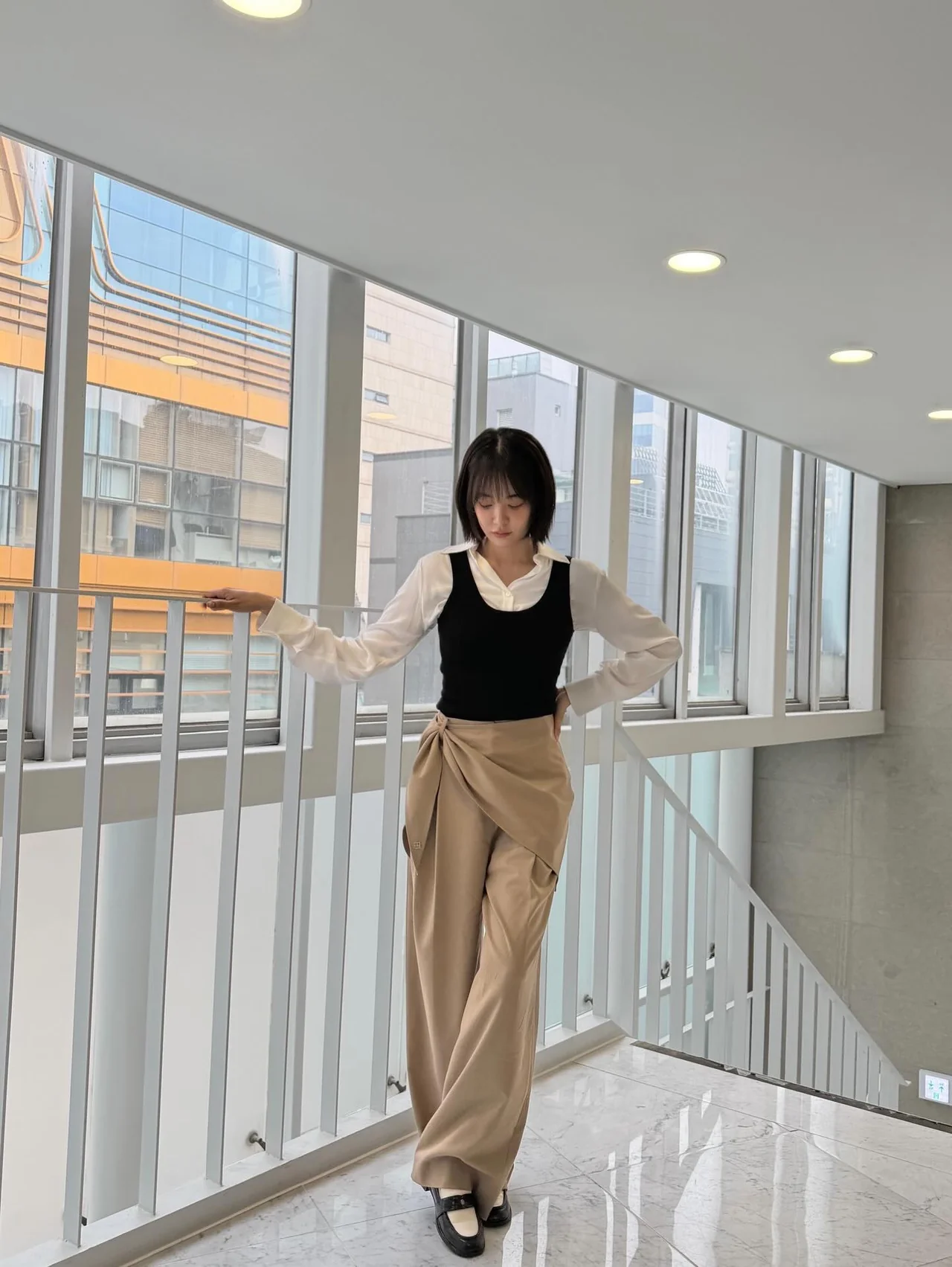 White shirt and black vest | A clean layered look finished with a pared-down color palette / Photo: Joo-yeon Lee, Instagram