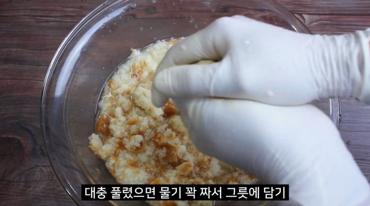 &nbsp;  Squeezing water from soaked bread. / YouTube \'Jipbap (Korean Home Cooking)\'