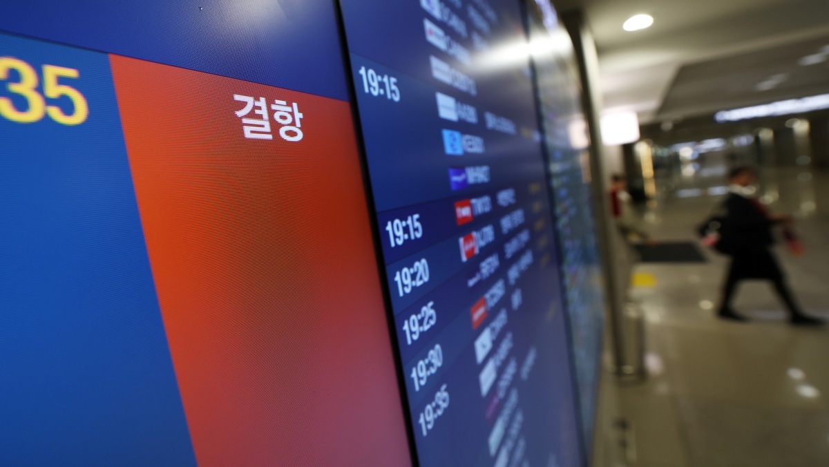 Illustrative image. A departures board at Incheon International Airport Terminal 1 displays a canceled Abu Dhabi flight notice. / News1