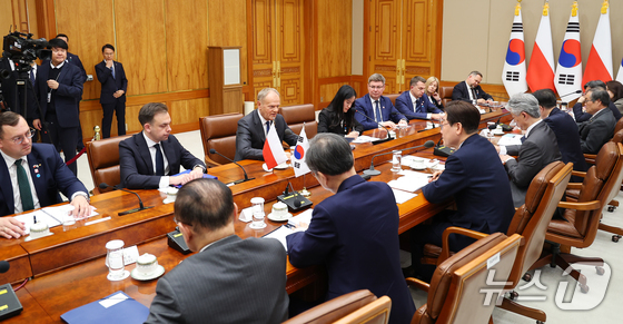 Polish Prime Minister Donald Tusk speaks during an expanded meeting with President Lee Jae Myung held at the Blue House on Monday (Blue House Press Corps) 2026.4.13 / News1
