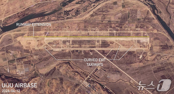 A satellite image of the Uiju Air Base in Sinuiju, North Korea, captured by Planet Labs on April 12. The yellow solid line indicates the runway, and the yellow dotted line marks the extended runway / Capture from NK News