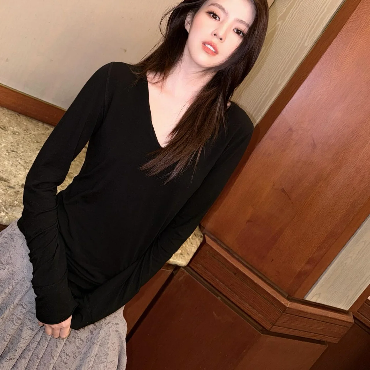 &nbsp;     V-neck long sleeve | Deep V-neck black knit that emphasizes the neckline and adds chic appeal / Photo: Han So-hee\'s Instagram
