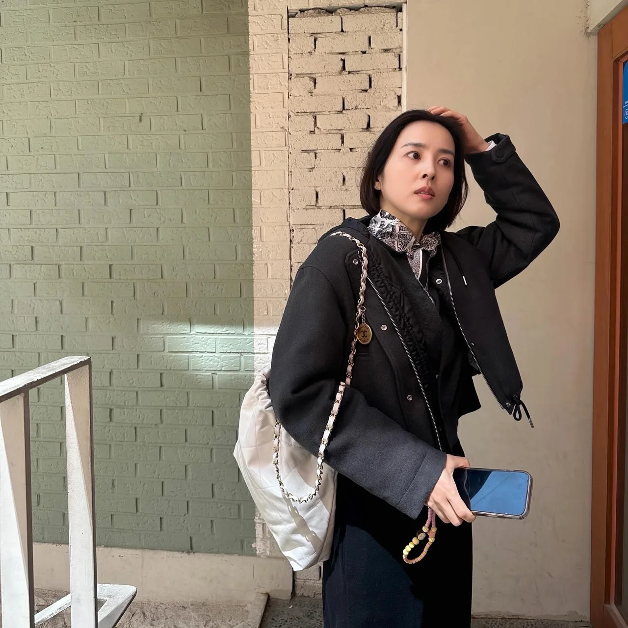 &nbsp;  Charcoal black jacket + white shirt collar + paisley scarf at a cafe terrace / Photo=Han Hye-jin Instagram (@hanhyejin_official)