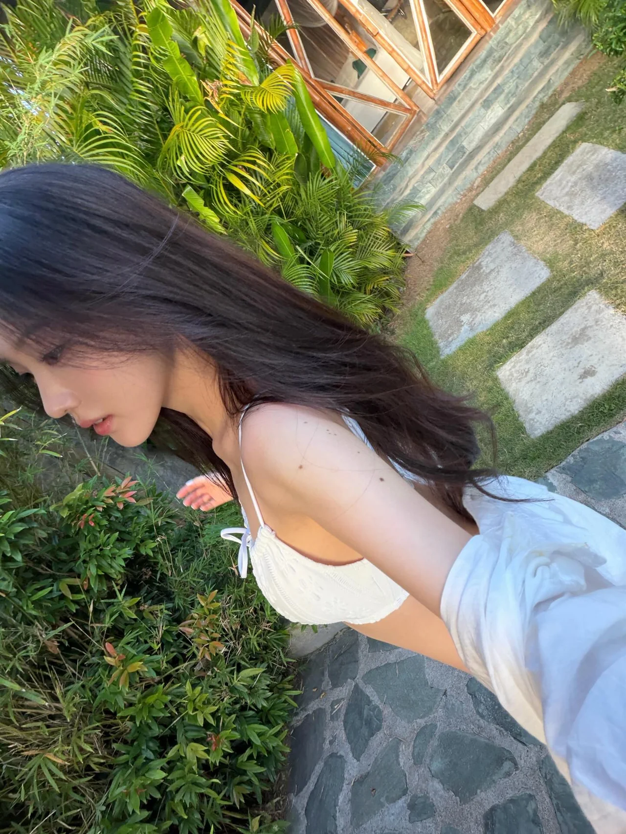 Oversized white shirt | Lightly draped over a bikini for style and sun protection at once /Photo=Kang Na-eon Instagram