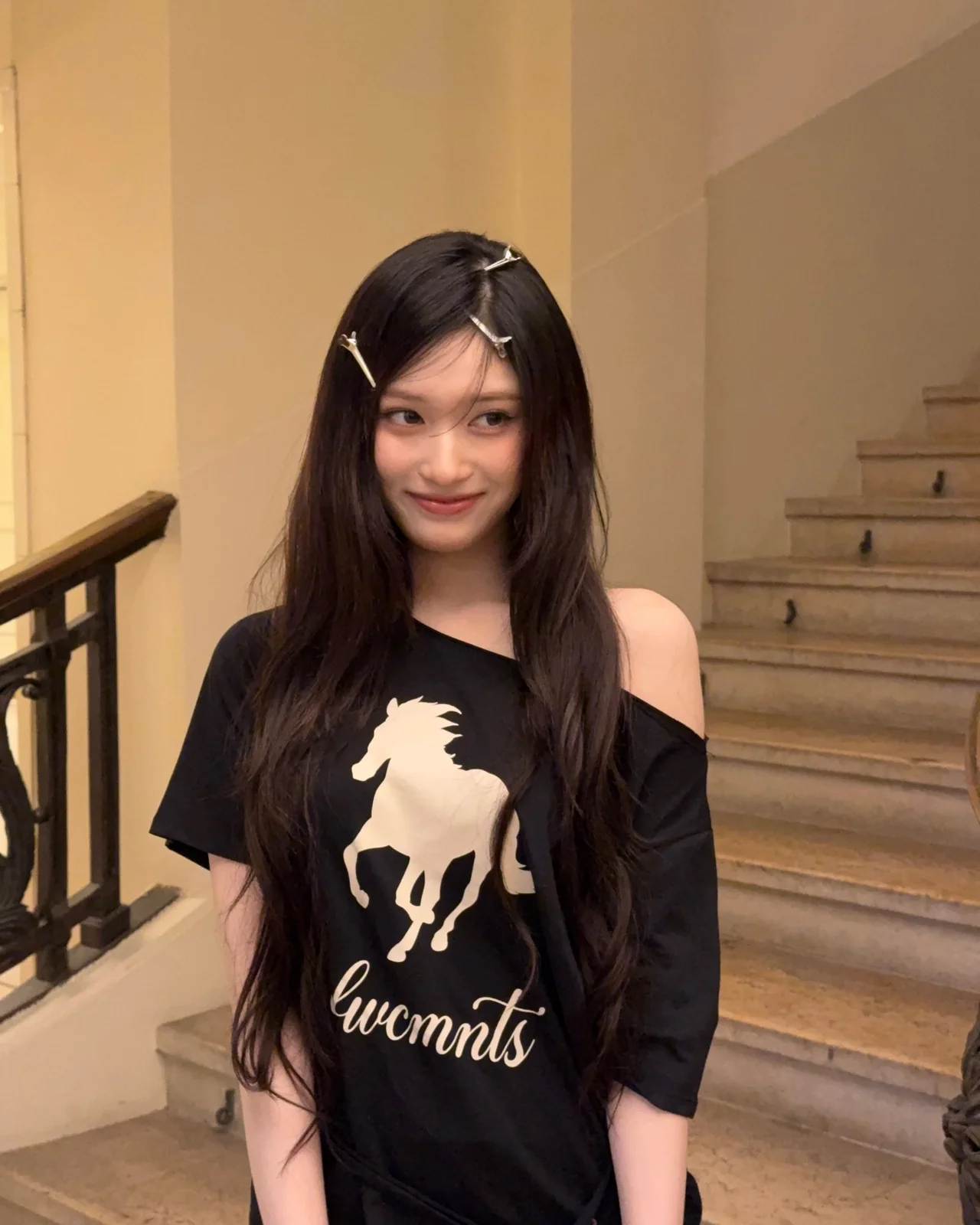 Off-the-shoulder graphic T-shirt | A loose black tee styled off the shoulder for a cool, edgy vibe