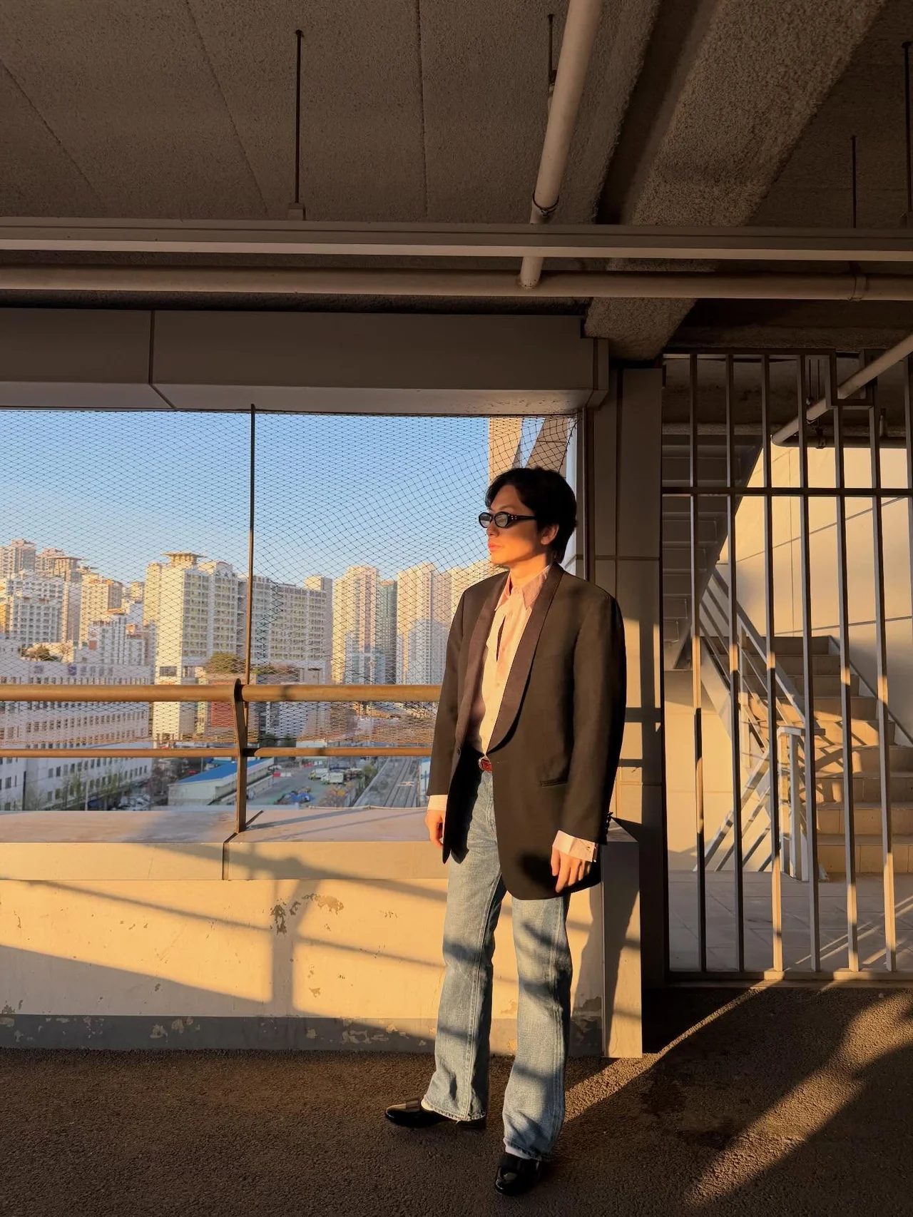 Dark khaki single‑button blazer + cream shirt + light‑blue wide denim + black sunglasses — smart casual / Photo = Lee Dong‑hwi Instagram (@leedongwhee)