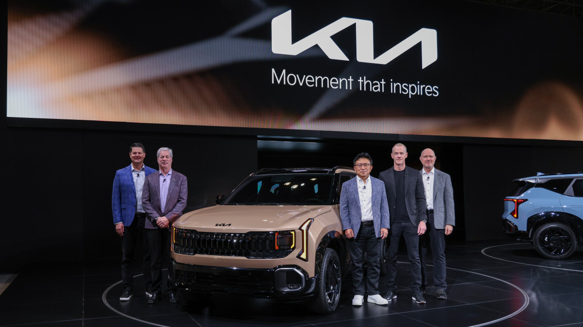 Photo=KiaKia North America representatives posing in front of the Seltos X-Line.