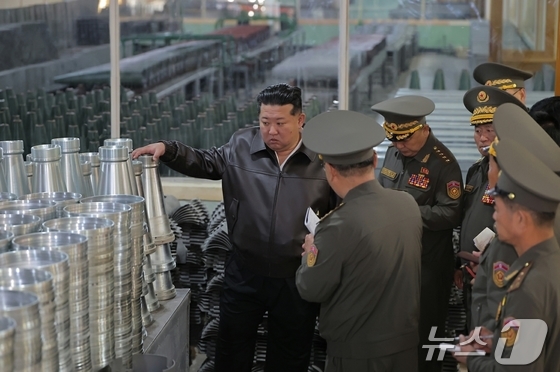 North Korean leader Kim Jong Un visits multiple defense industry facilities on May 11, according to the ruling Workers’ Party newspaper Rodong Sinmun on May 13. Kim toured factories producing mortar and artillery shells as well as ammunition alongside military officials. / Courtesy of News1