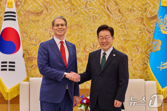 South Korean President Lee Jae Myung shakes hands with U.S. Treasury Secretary Scott Bessent at the presidential office in Seoul on May 13. (Provided by the presidential office. Resale and DB prohibited) May 13, 2026. / Courtesy of News1