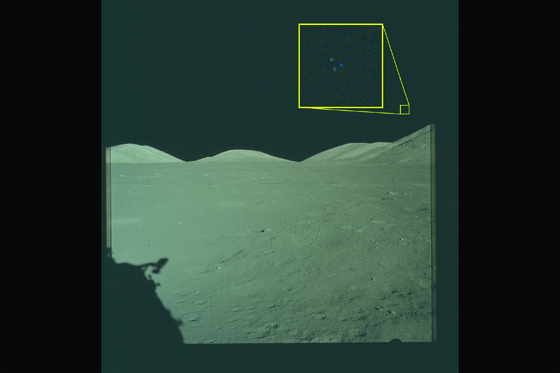 A photo taken on the surface of the Moon during the Apollo 17 mission in 1972, from among the materials related to Unidentified Aerial Phenomena (UAP) released by the U.S. Department of Defense on May 8. Three lights can be seen above the lunar terrain in the enlarged area within the yellow box. / U.S. Department of Defense UAP Disclosure Materials Homepage