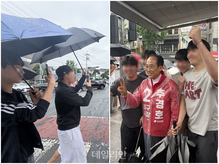 추경호 국민의힘 대구시장 후보가 2일 오전 대구 북구 경북대학교 앞에서 학생들과 함께 사진 촬영을 하고 있다. 왼쪽은 추 후보를 보고 환호성을 지르는 학생들. ⓒ 데일리안 김수현 기자